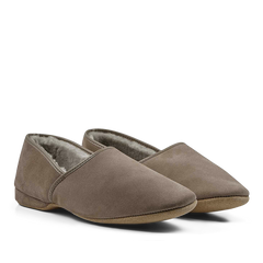 A pair of Derek Rose Taupe Suede Sheepskin Closed-Back Slippers with a fluffy sheepskin lining.