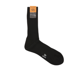 A single Black Cotton Fil d'Ècosse Ribbed Sock from Doré Doré, with the brand logo on the side, displayed against a white background with a product tag attached to the cuff.