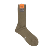 A single Terre Green Cotton Fil d'Ècosse Ribbed Sock with a ribbed design and an orange label, crafted from mercerised cotton lisle, displayed against a white background by Doré Doré.