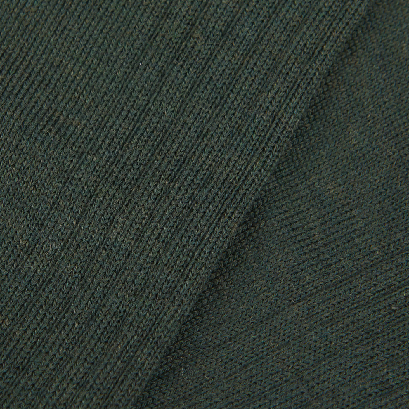 A close up of a hardwearing Thuya Green Merino Wool Ribbed Socks by Doré Doré.