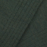 A close up of a hardwearing Thuya Green Merino Wool Ribbed Socks by Doré Doré.