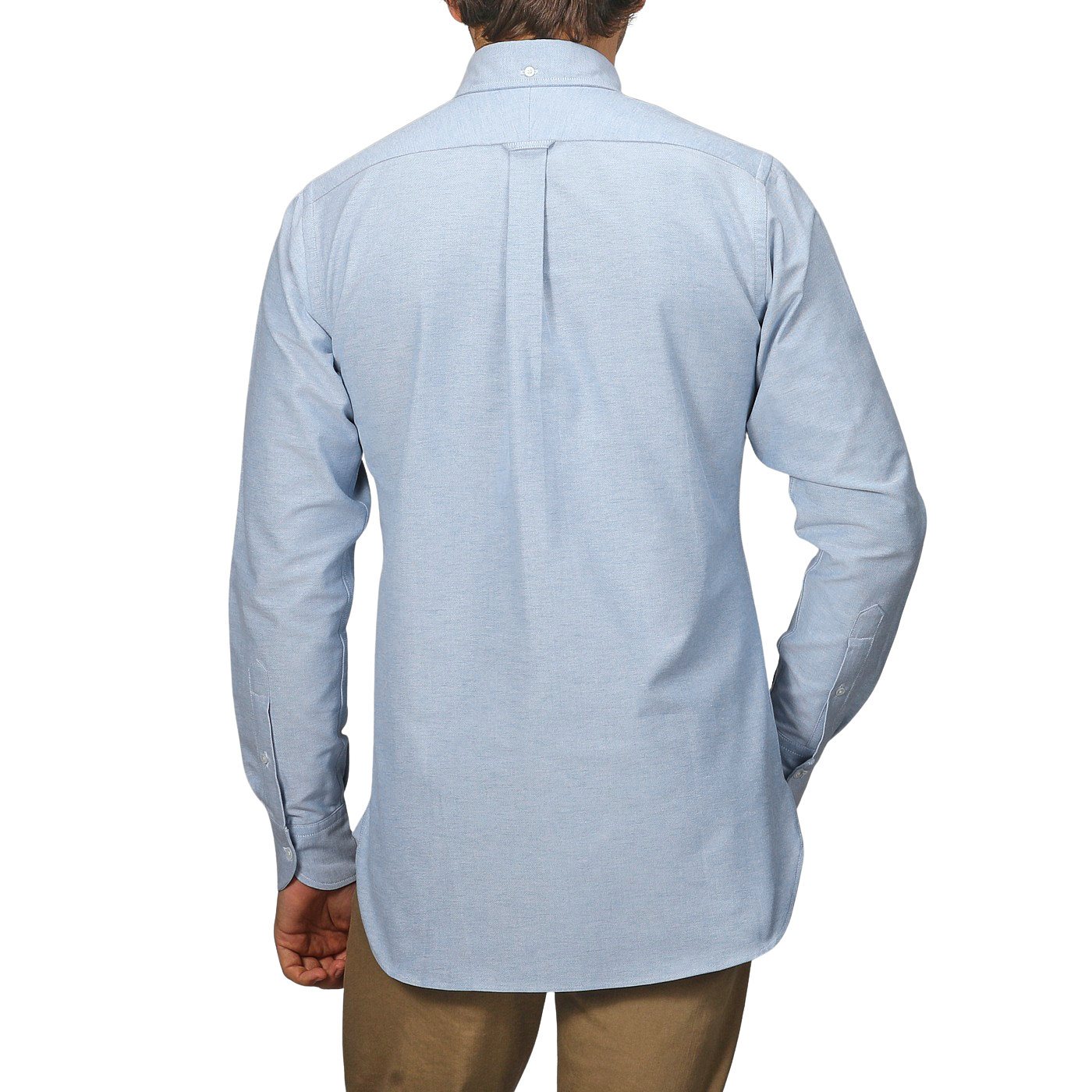 A man is seen from behind in a Blue Classic Cotton Oxford BD Shirt by Drake's, paired with beige pants against a plain background.