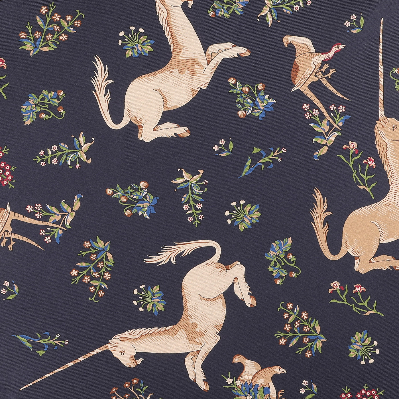 The Navy Unicorn Print Tubular Silk Scarf by Drake's showcases a patterned design with illustrated unicorns and floral elements on a dark background, capturing the essence of an archival brand design.