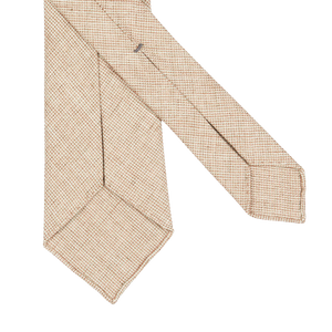 A handmade Beige Melange 7-Fold French Linen Tie made by Dreaming Of Monday, showcased against a clean white background.