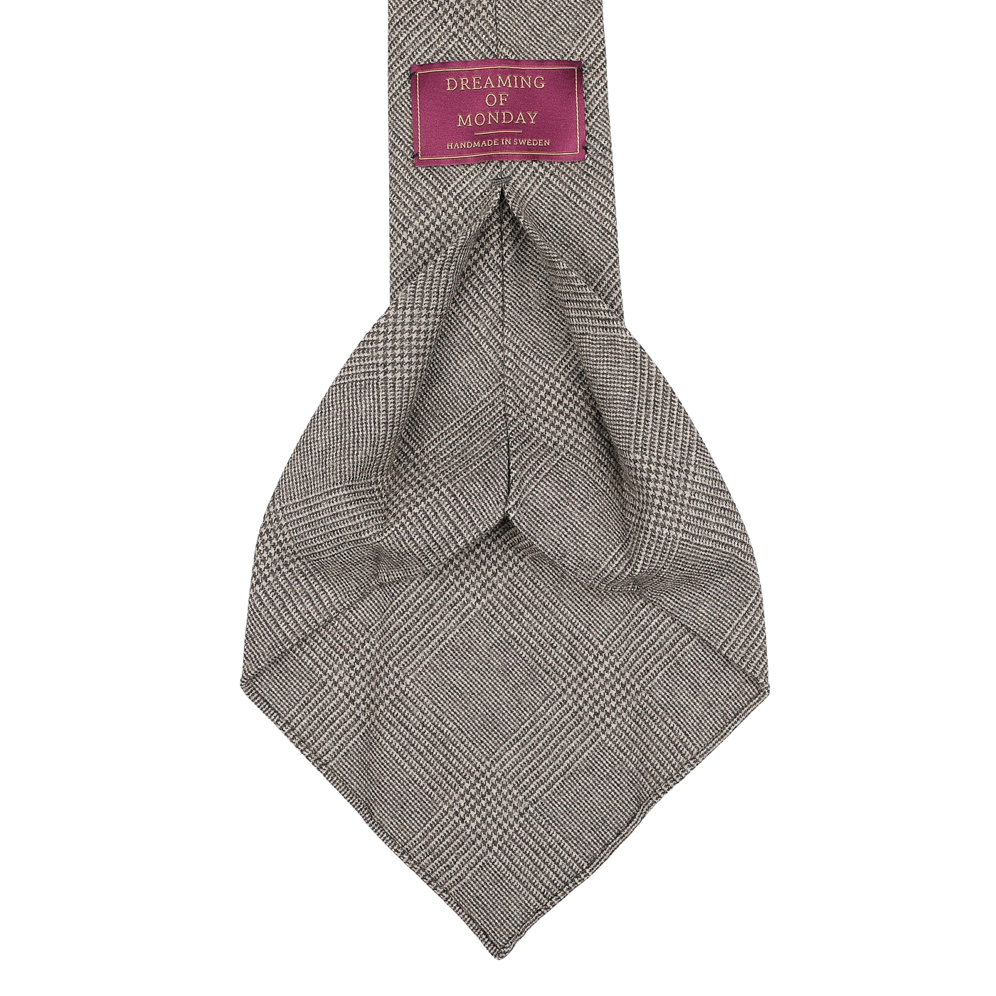 The Brown Glen-Check 7-Fold Wool Flannel Tie from Dreaming Of Monday is expertly handmade in Sweden and features a purple tag with white text, adding a touch of elegance.