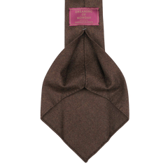 Dark brown 7-fold wool flannel tie by Dreaming Of Monday, featuring a label with white text on a pink background.