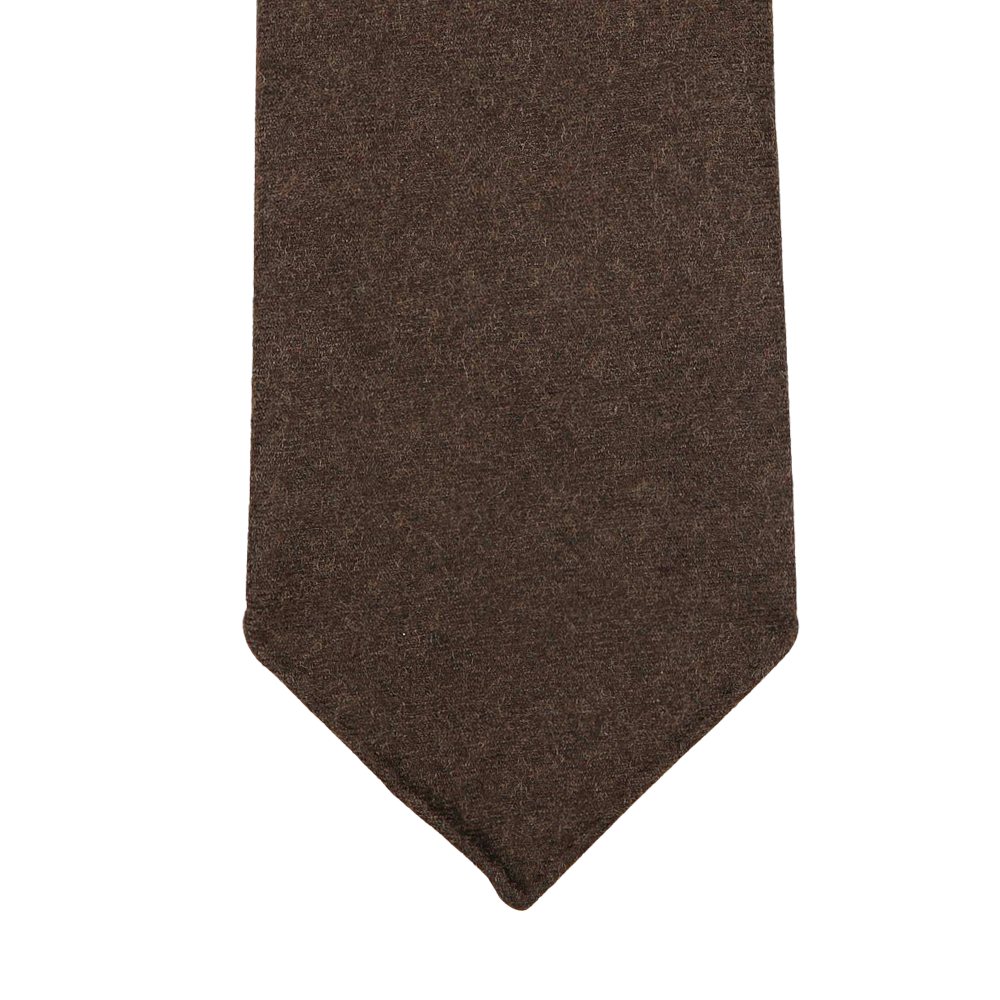 Dreaming Of Monday presents their Dark Brown 7-Fold Wool Flannel Tie, featuring a textured design with a pointed tip, handmade in Sweden.