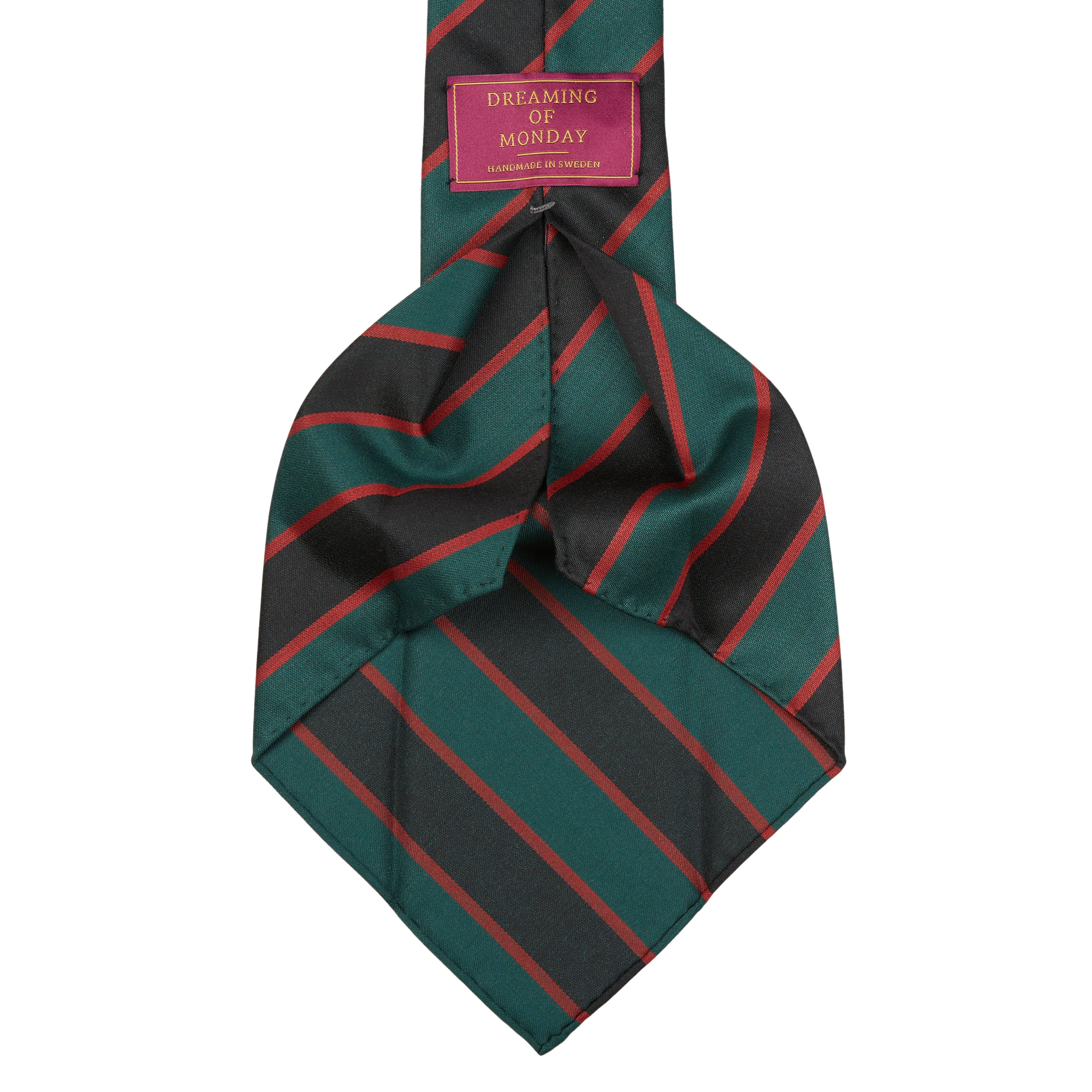 A skinny neck tie with a striped pattern in shades of green and red, handmade from a lightweight wool mix. The Green Black Regimental 7-Fold Wool Tie by Dreaming Of Monday.