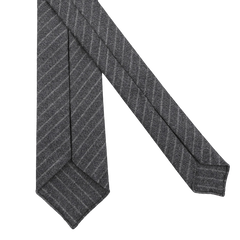 Dreaming Of Monday's Grey Beige Chalkstripe 7-Fold Vintage Wool Tie, featuring elegant diagonal lines, is showcased on a pristine white background.