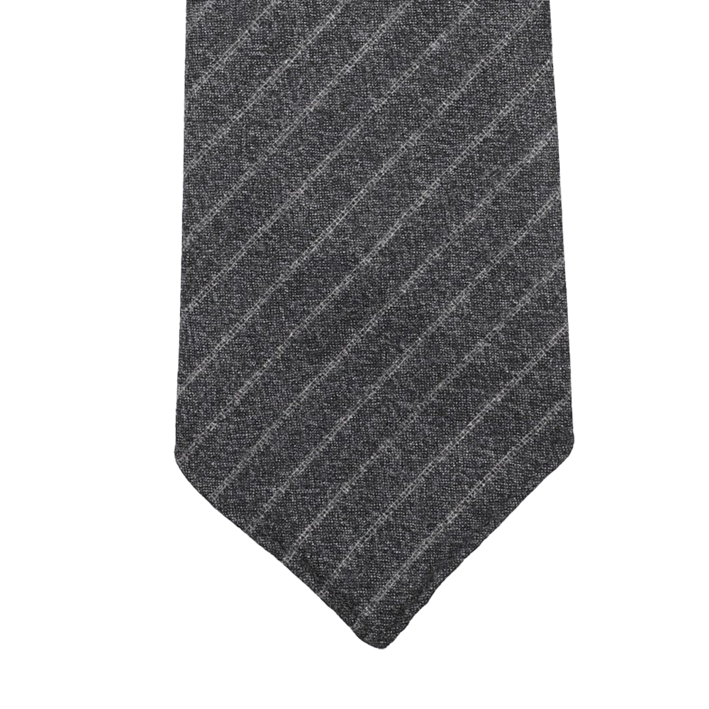 The Grey Beige Chalkstripe 7-Fold Vintage Wool Tie by Dreaming Of Monday features a diagonally striped dark gray and light gray design displayed elegantly on a white background.