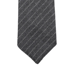 The Grey Beige Chalkstripe 7-Fold Vintage Wool Tie by Dreaming Of Monday features a diagonally striped dark gray and light gray design displayed elegantly on a white background.