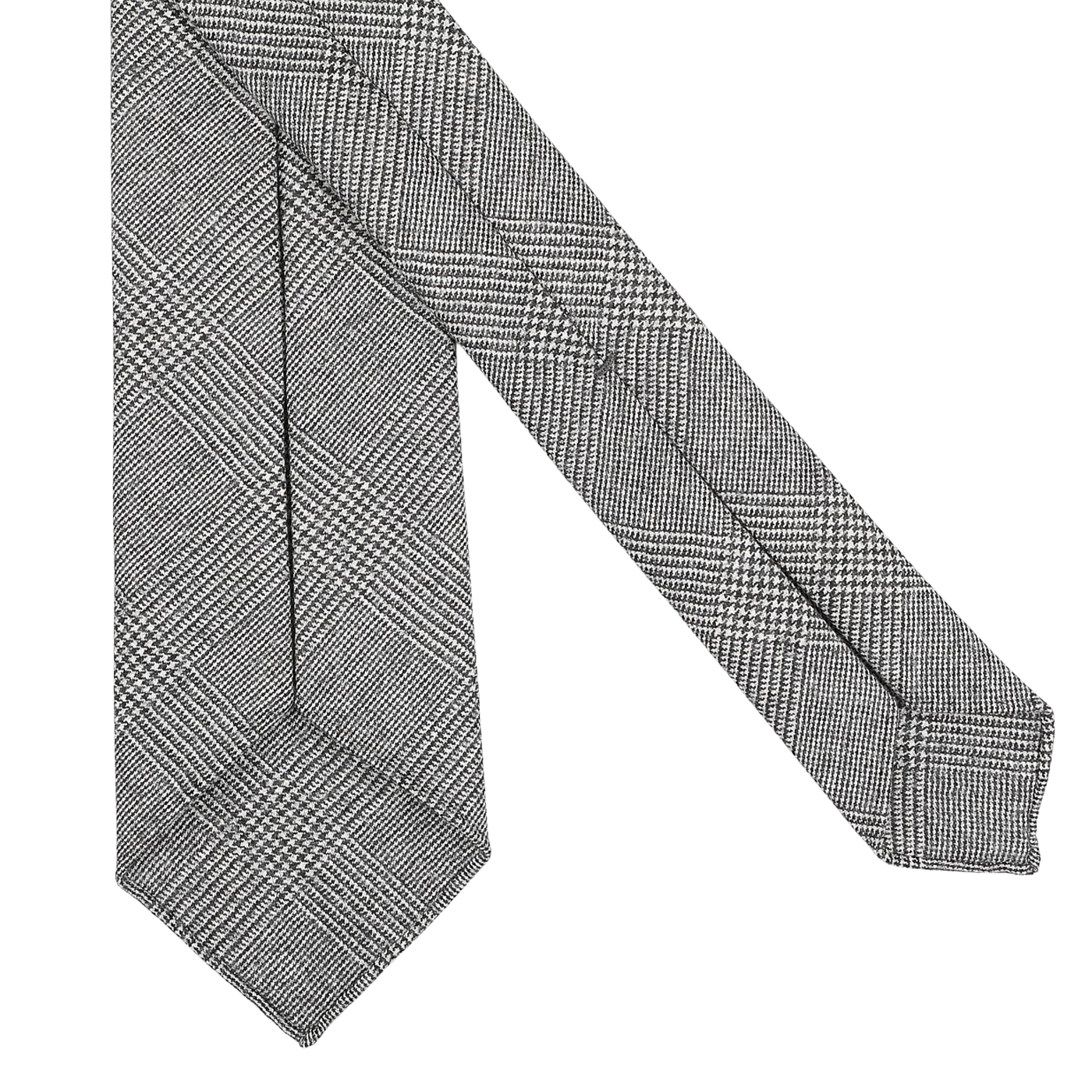 Close-up of the Grey Glen-Checked 7-Fold Wool Flannel Tie by Dreaming Of Monday, featuring a sophisticated grey-black glencheck design with an intricate black and white houndstooth pattern on a pristine white backdrop.