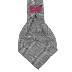 A luxurious super 120s wool flannel necktie in gray Glen check, featuring an unlined 7-fold construction and labeled "Dreaming Of Monday".