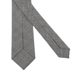 The Dreaming Of Monday Grey Micro Glen Plaid 7-Fold Vintage Wool Tie features a sophisticated plaid design, set against a plain white background.