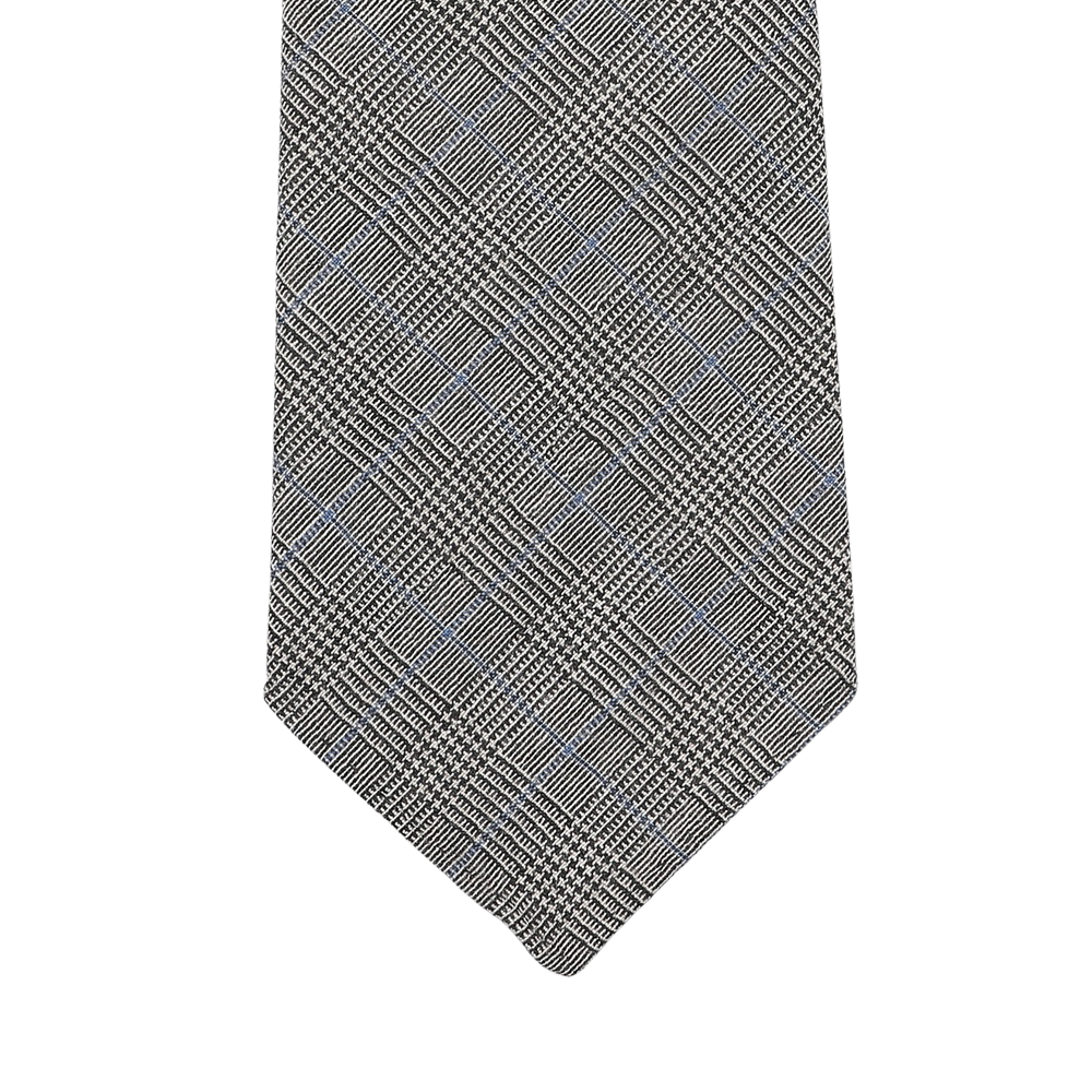 A close-up of the Grey Micro Glen Plaid 7-Fold Vintage Wool Tie from Dreaming Of Monday highlights its micro glen checked pattern and the elegance of unlined 7-fold construction.