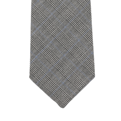 A close-up of the Grey Micro Glen Plaid 7-Fold Vintage Wool Tie from Dreaming Of Monday highlights its micro glen checked pattern and the elegance of unlined 7-fold construction.