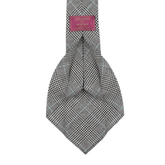 The Grey Prince of Wales 7-Fold tie, crafted in Sweden from vintage wool, has a burgundy label that says "Dreaming Of Monday.