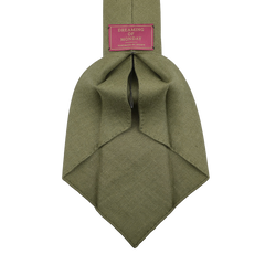 The Jardin Provençal Green 7-Fold French Linen Tie by Dreaming Of Monday, in olive green, is shown on a white background.