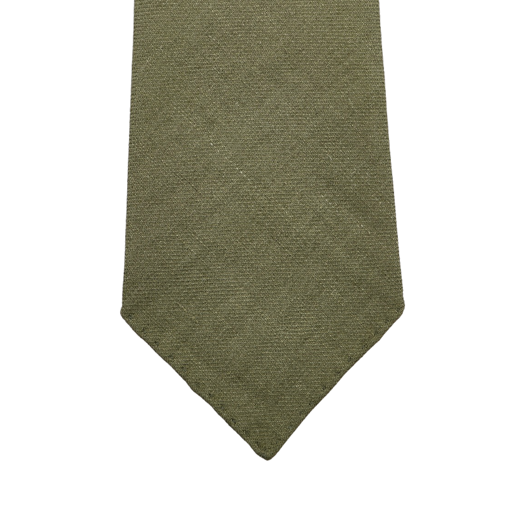 The Jardin Provençal Green 7-Fold French Linen Tie by Dreaming Of Monday is handmade with a textured olive hue and has a classic pointed tip.