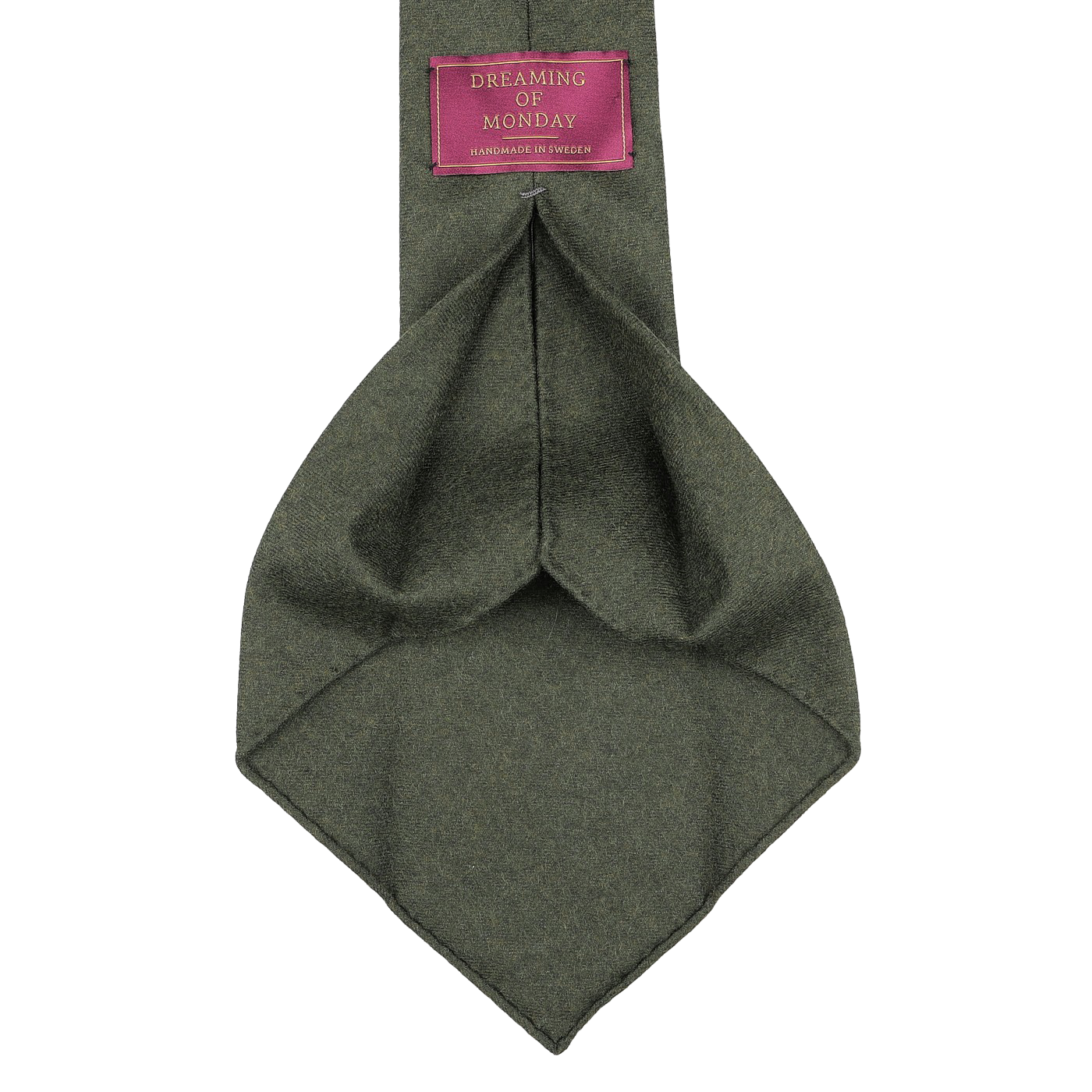 A luxurious wool flannel tie in moss green, made by Dreaming of Monday, includes a tag that says "Handmade in Sweden.