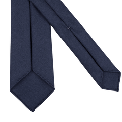 Close-up of a Navy Blue 7-Fold Wool Flannel Tie by Dreaming Of Monday displayed on a plain white background.