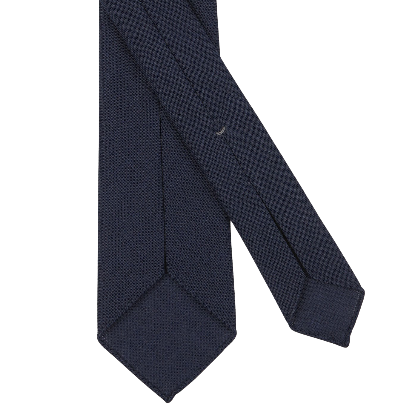 A close-up of a Dreaming Of Monday Navy Blue Wool Fresco 7-Fold Tie with a slim width and pointed ends, crafted from pure high-twist wool, set against a plain white background.