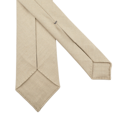 The Rocher Rouge Beige 7-Fold French Linen Tie by Dreaming Of Monday is shown on a white background, highlighting its rear side and detailed stitching.