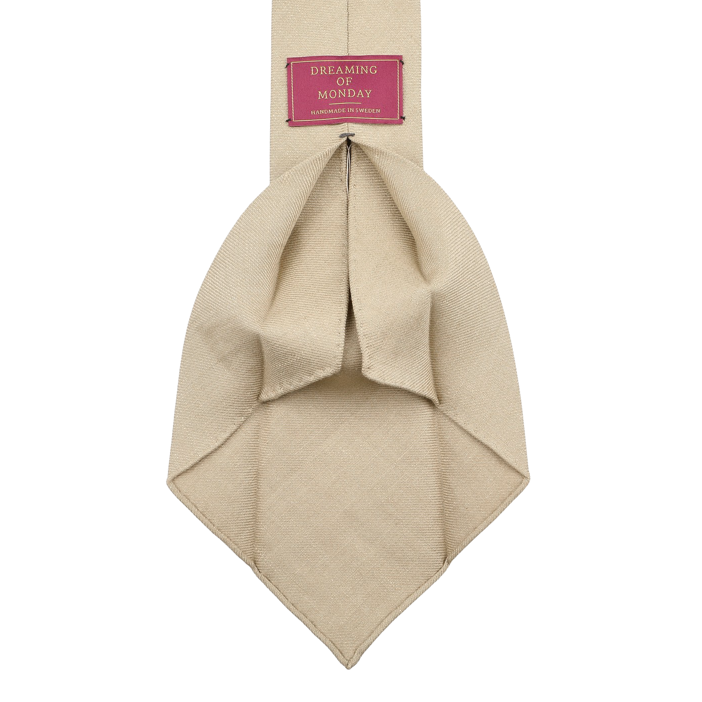 The Rocher Rouge Beige 7-Fold French Linen Tie by Dreaming Of Monday features a red label with "Dreaming of Monday" in crisp white text.