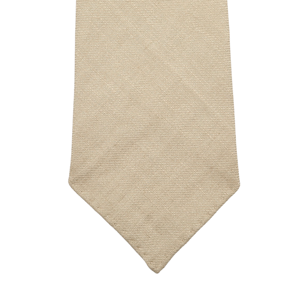 Close-up of the Rocher Rouge Beige 7-Fold French Linen Tie by Dreaming Of Monday on a white background.