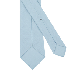 A Sky Blue 7-Fold Wool Hopsack Tie by Dreaming Of Monday is laid out flat on a white background.