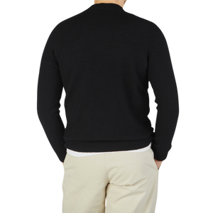 The back view of a man wearing a Drumohr Black Brushed Lambswool High Neck Sweater.