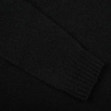 A close up of a Drumohr Black Brushed Lambswool High Neck Sweater.
