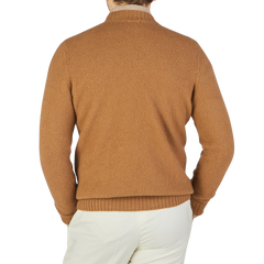 The back view of a man wearing a Drumohr Camel Brushed Lambswool High Neck Sweater.