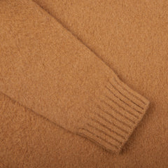 A close up of a Drumohr Camel Brushed Lambswool High Neck Sweater with a brushed finish.