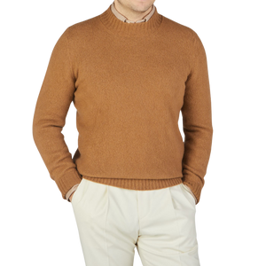 A man wearing a Drumohr Camel Brushed Lambswool High Neck Sweater.