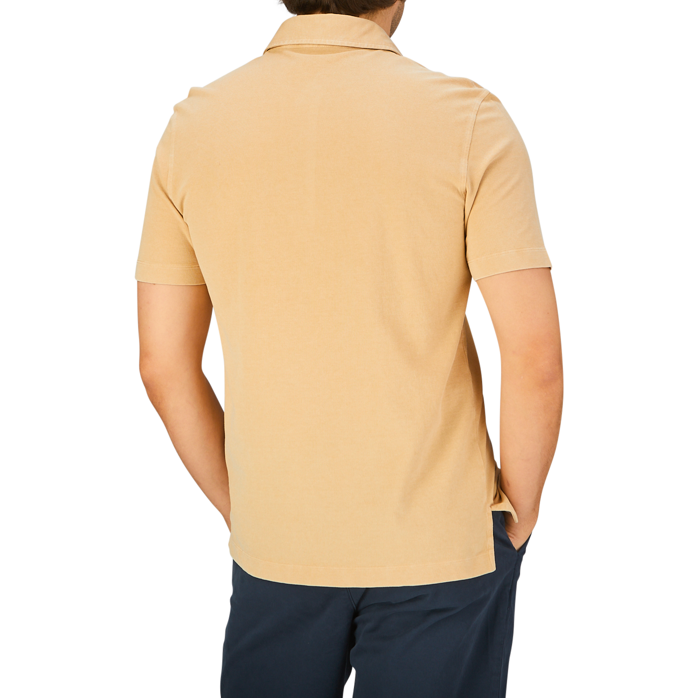 Rear view of a person wearing a Cappuccino Beige Cotton Piquet Drumohr slim fit polo shirt and dark trousers.