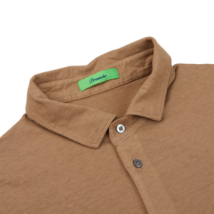 A coffee brown cotton linen polo shirt with green buttons made in Italy by Drumohr.