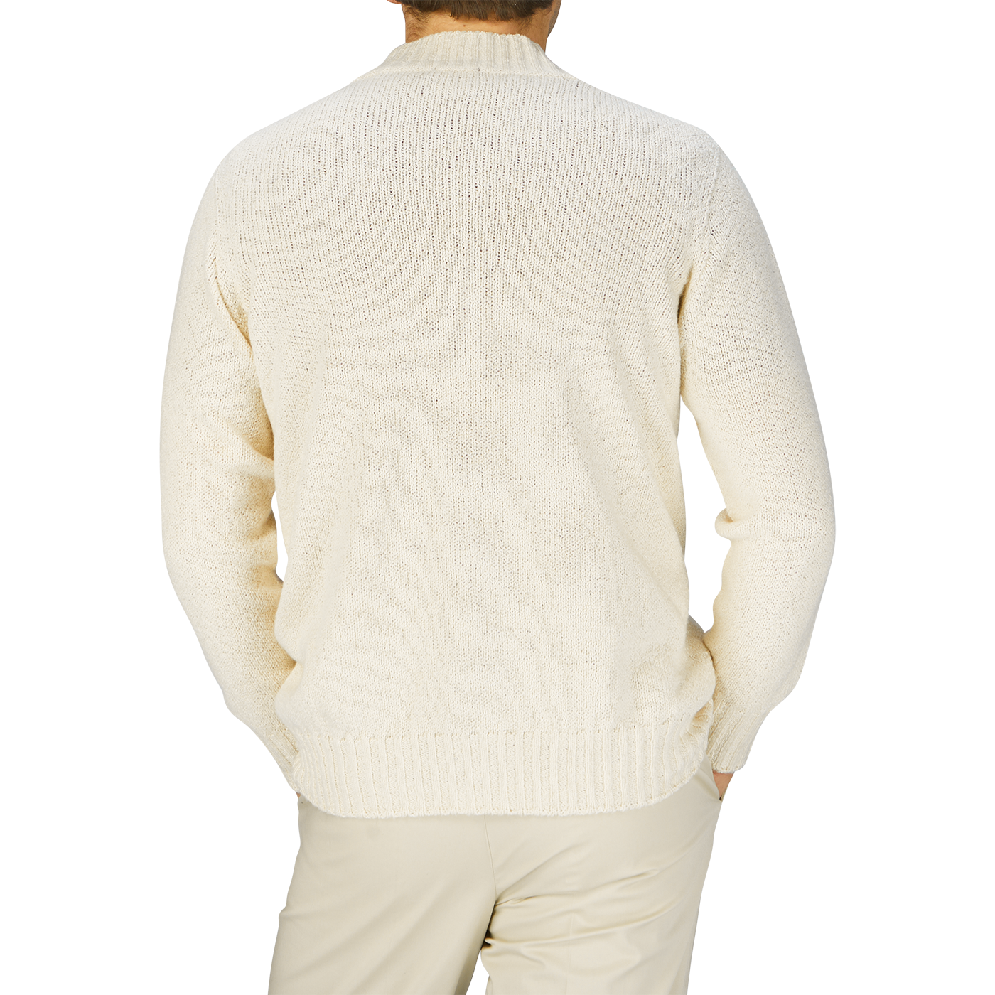 The man is seen from behind, dressed in a Drumohr ecru white knitted cotton cardigan.