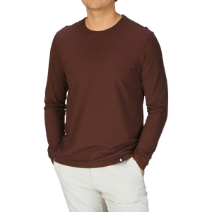 A man wearing a Drumohr Golden Brown Ice Cotton LS T-Shirt from Italy.
