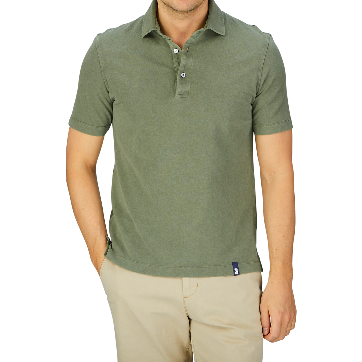 Man wearing a grass green Drumohr cotton piquet polo shirt from Italy and beige trousers.