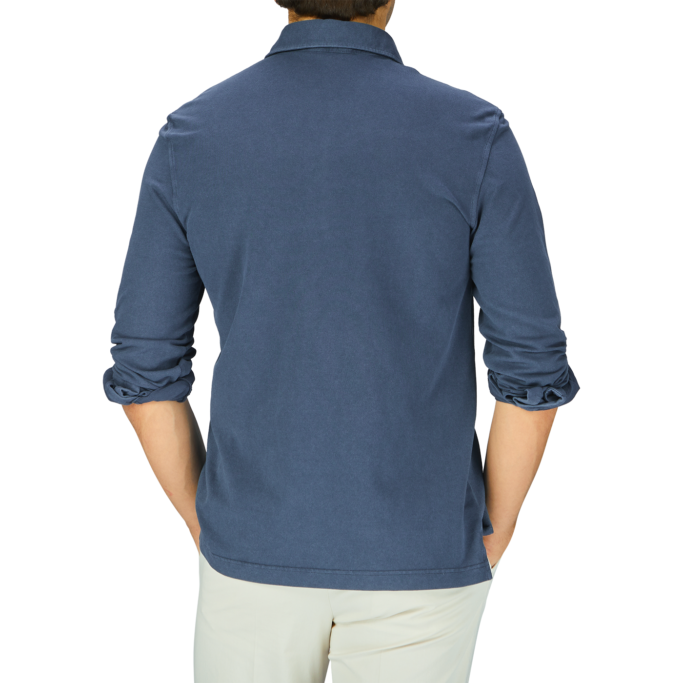 The man is wearing a Medium Blue Cotton Piquet LS Polo Shirt by Drumohr.