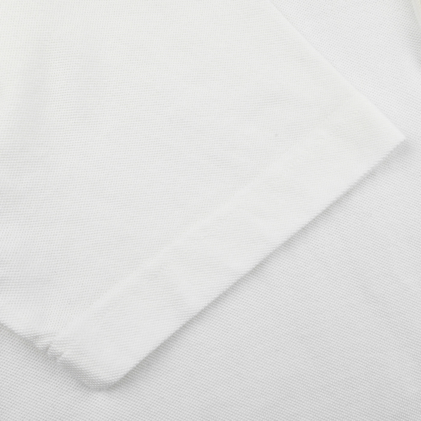 Close-up of a Drumohr Off-White Cotton Pique Polo Shirt with visible seam and corner detail.