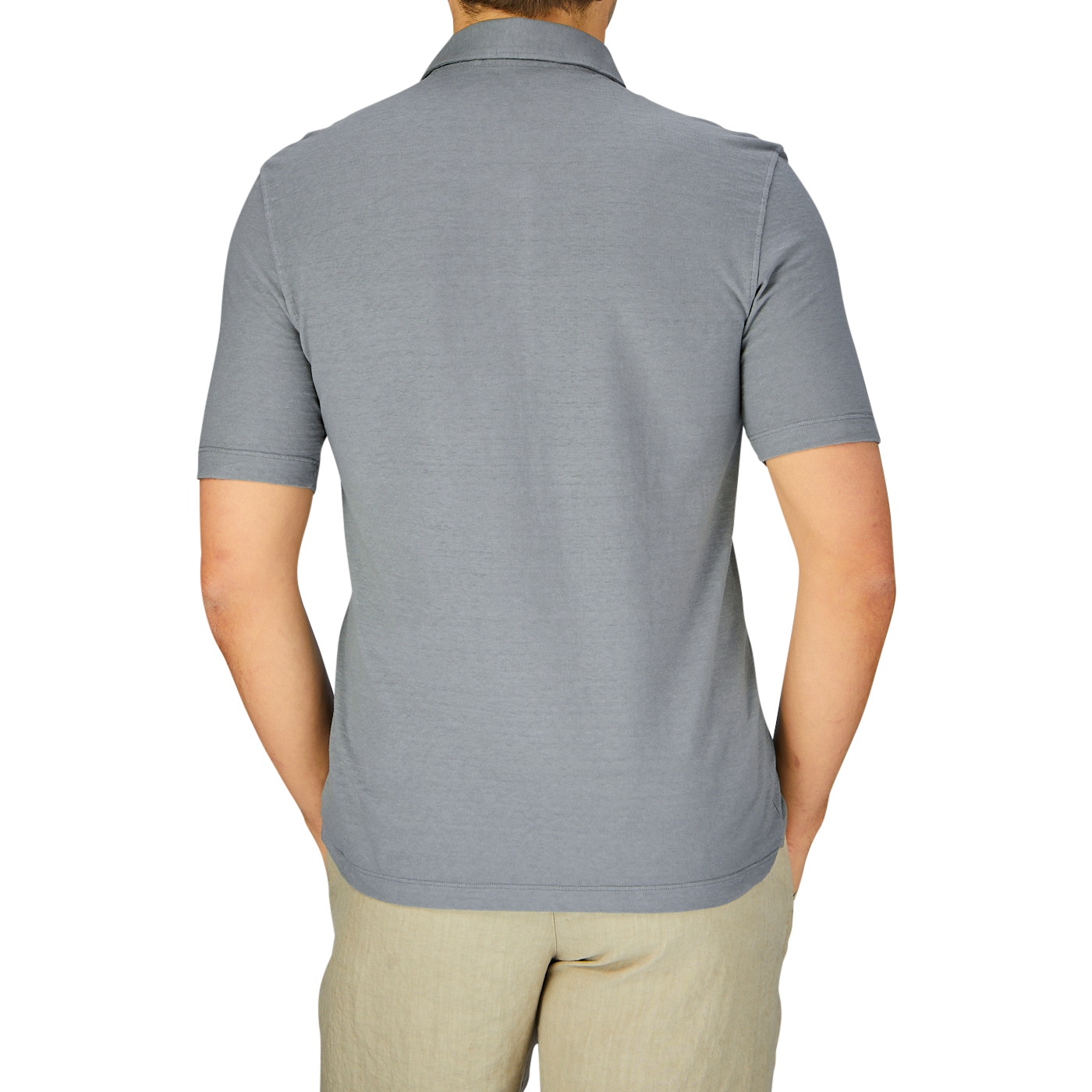Rear view of a man wearing a Drumohr Steel Grey Cotton Linen Polo Shirt and khaki pants.