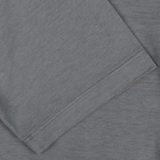 Close-up of a folded Steel Grey Cotton Linen Drumohr polo shirt with visible texture and stitching, made in Italy.