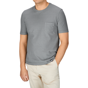 A man wearing a Drumohr Steel Grey Cotton Linen T-Shirt and khaki pants.