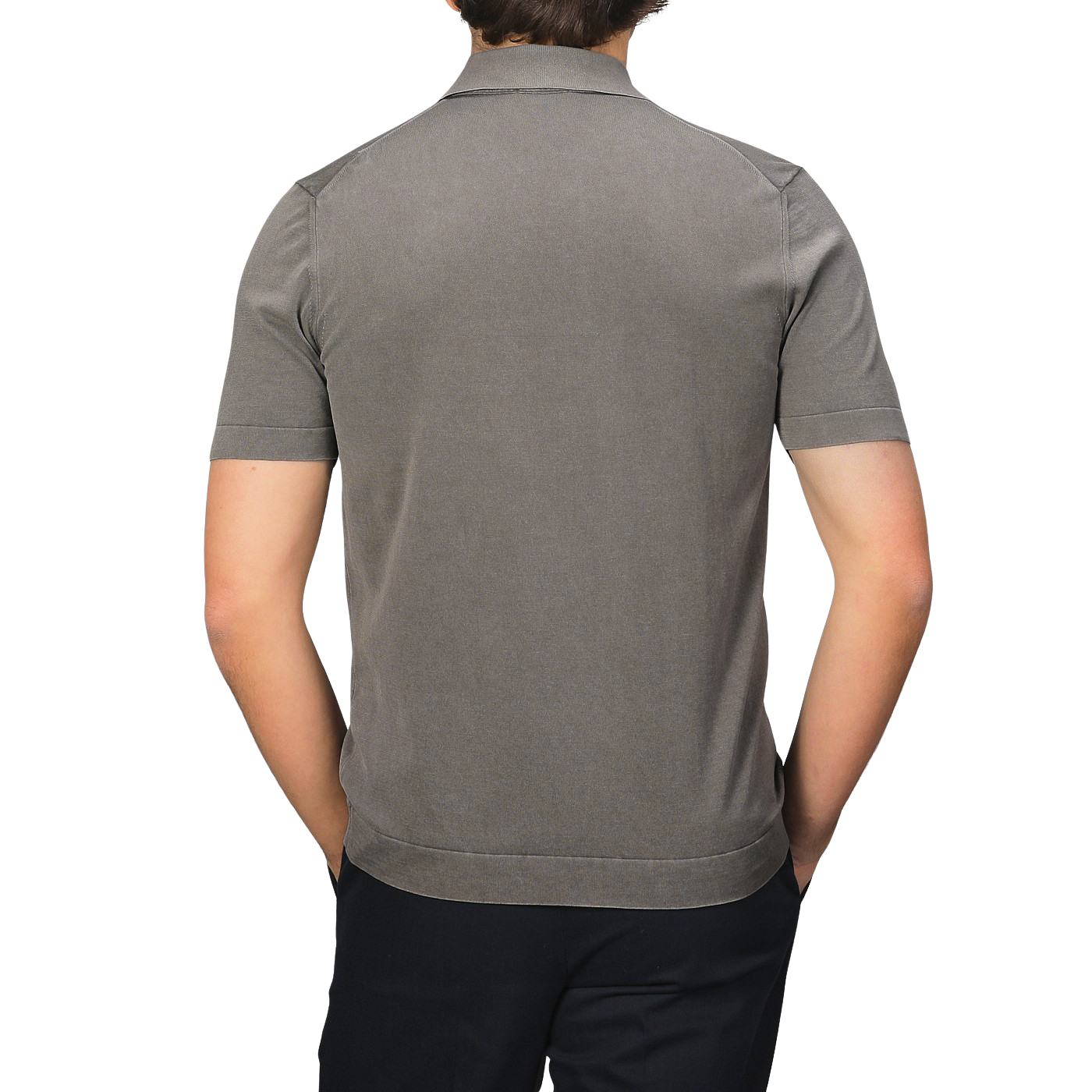 A person in a slim-fit Mole Washed Cotton Crepe Polo Shirt by Drumohr and black pants stands against a plain backdrop.