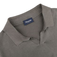 Close-up of a Drumohr Mole Washed Cotton Crepe Polo Shirt in gray, featuring a slim fit and visible brand label inside.