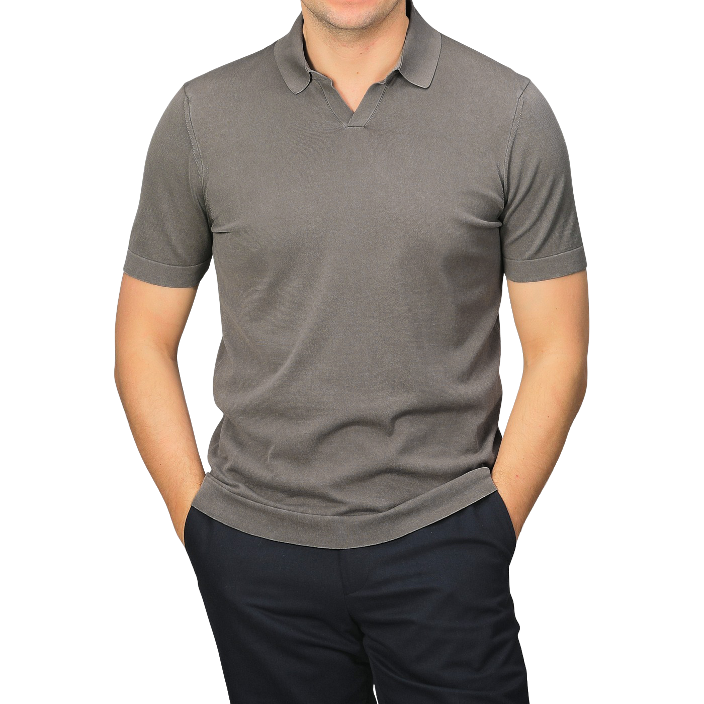 A person wearing a Drumohr Mole Washed Cotton Crepe Polo Shirt in slim fit gray with short sleeves, paired with dark pants and hands in pockets, stands against a gray background.