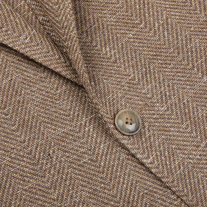 A close up image of an Eduard Dressler Brown Herringbone Cotton Blend Sendrik Blazer.