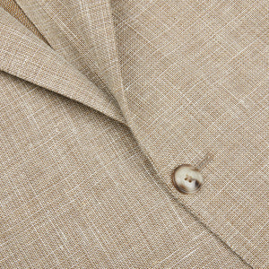 A close up of a Light Brown Wool Linen Hopsack Sendrik Blazer with buttons made from wool-linen fabric by Eduard Dressler.